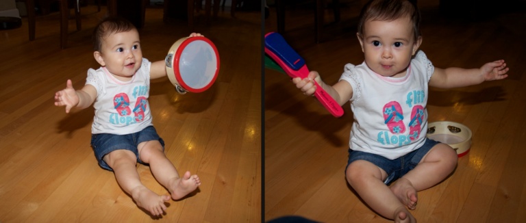 Ava playing with a tambourine and a toy maraca